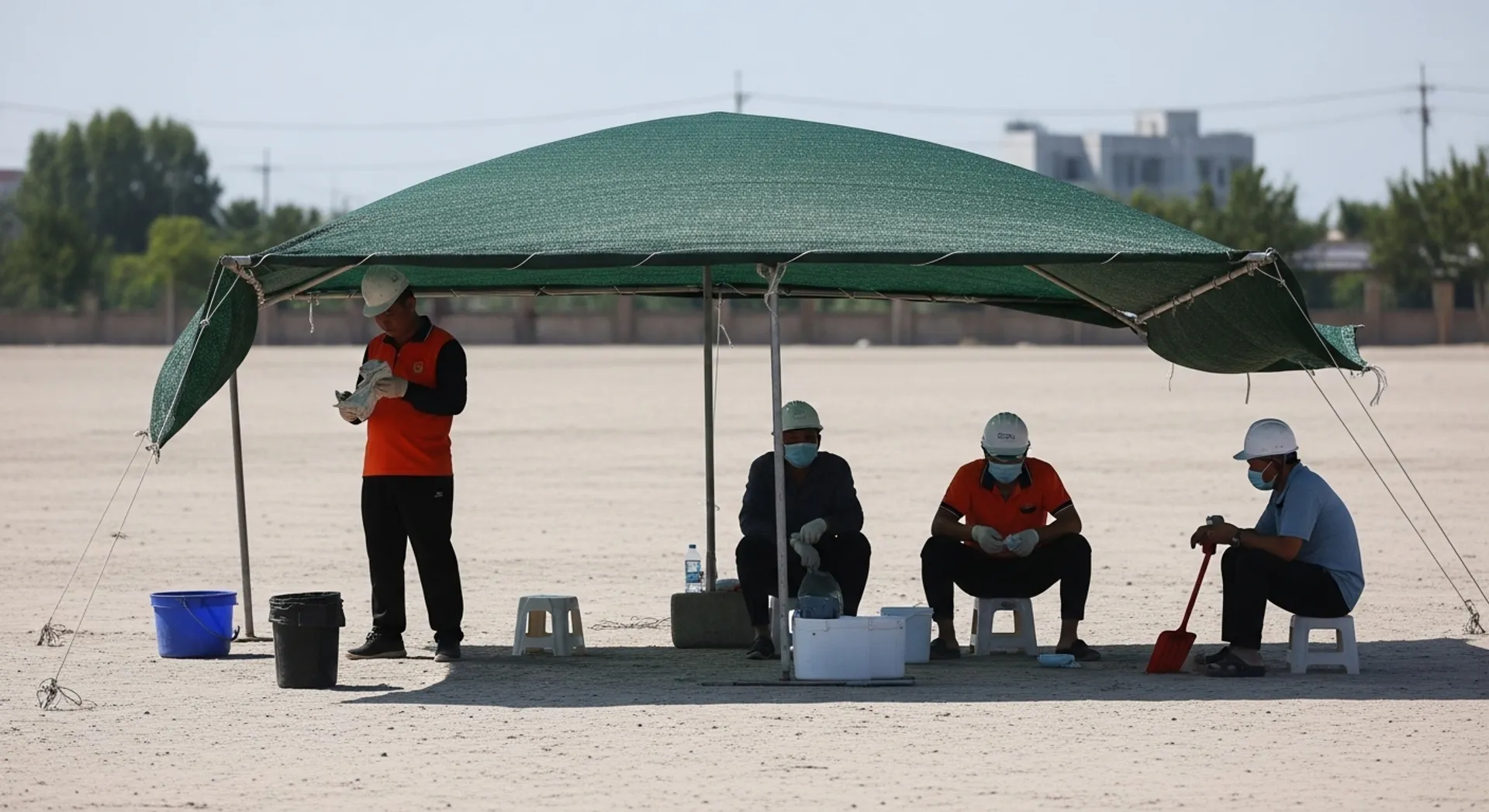outdoor workers cooling down in a shaded rest area